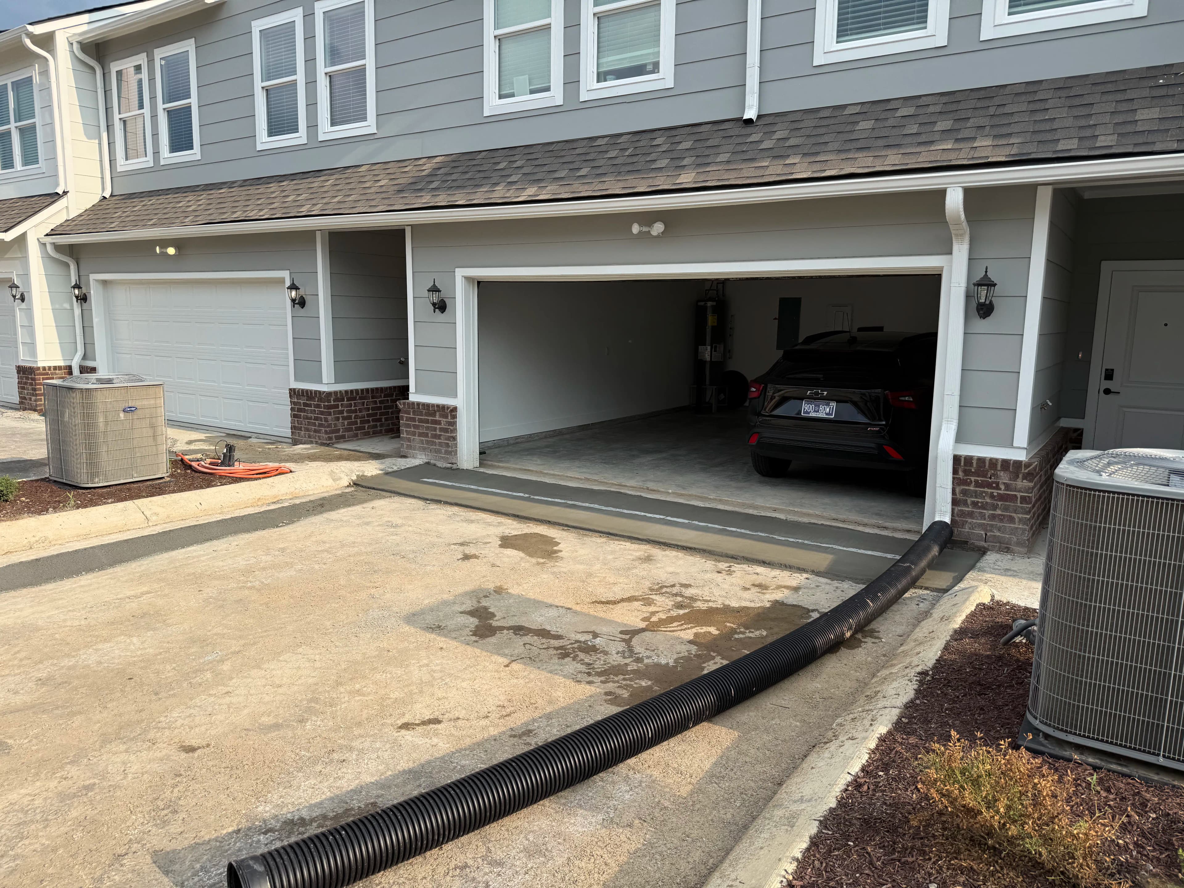 Project Trench Drain Install Puts a Stop to Driveway Flooding image